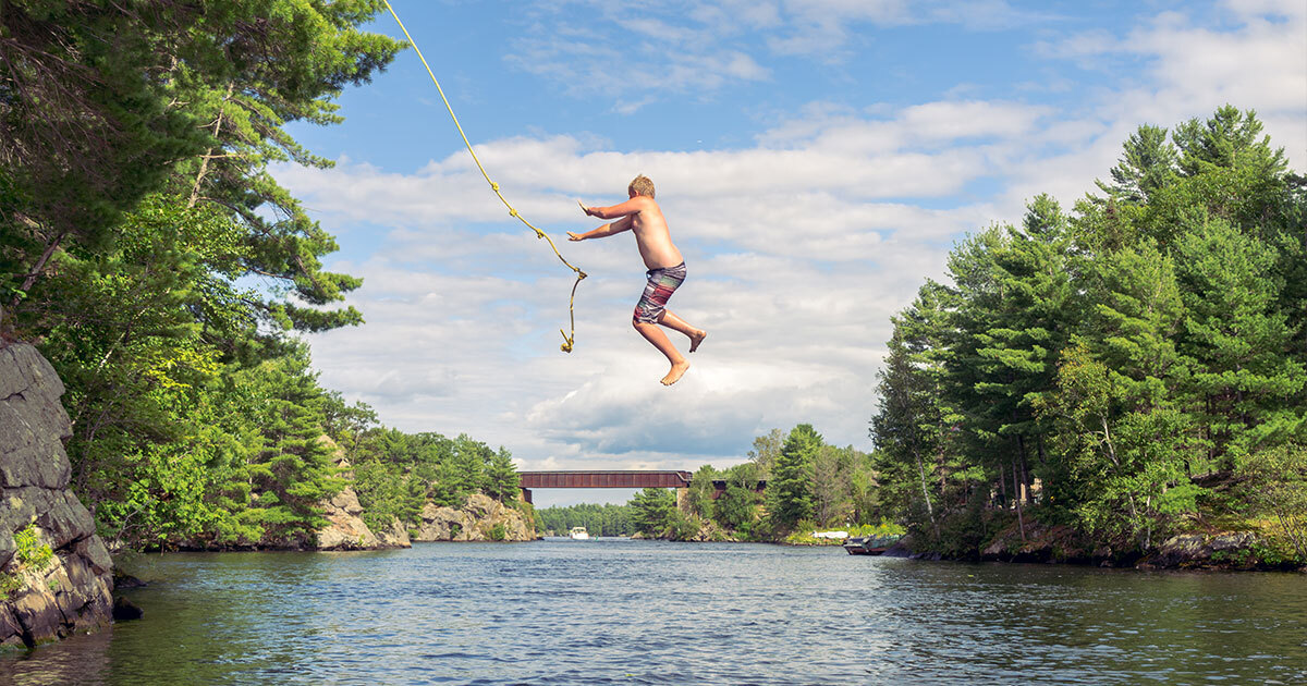 boy on a rope swing